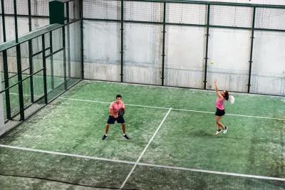 Mixed padel match padel court indoor